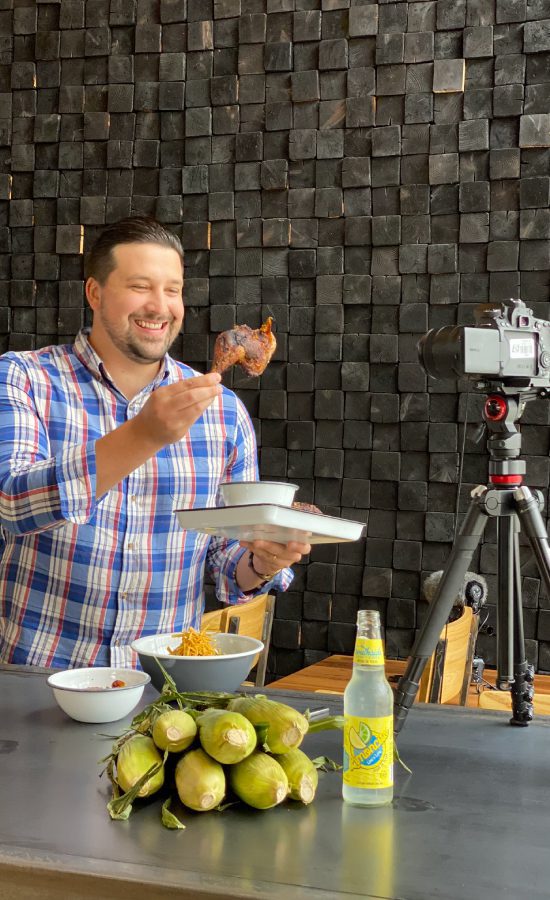 man eating in front of a camera